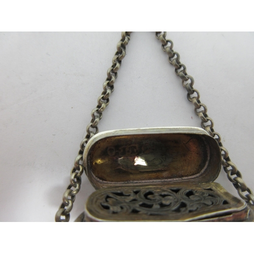 200 - A Victorian silver Vinaigrette of bombé form with floral and scroll decoration, scroll pierced grill... 