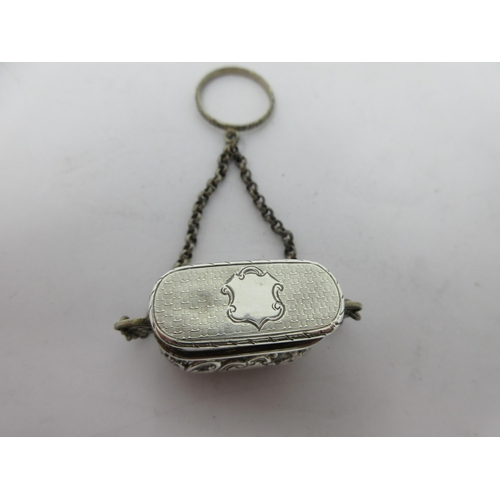 200 - A Victorian silver Vinaigrette of bombé form with floral and scroll decoration, scroll pierced grill... 