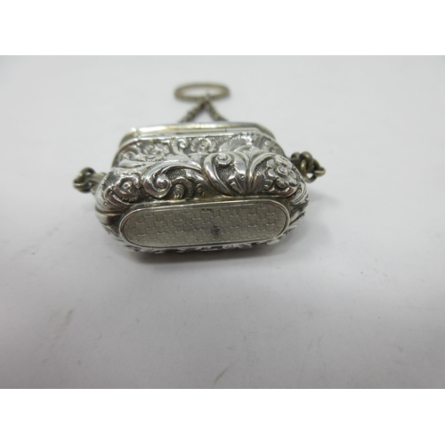 200 - A Victorian silver Vinaigrette of bombé form with floral and scroll decoration, scroll pierced grill... 