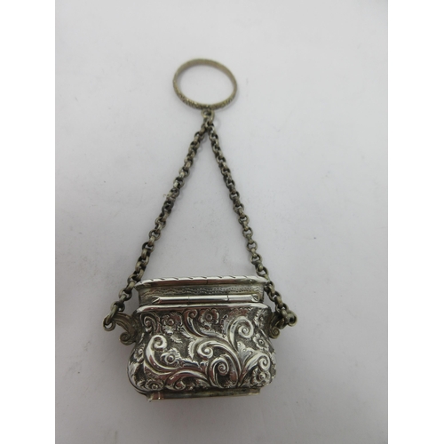 200 - A Victorian silver Vinaigrette of bombé form with floral and scroll decoration, scroll pierced grill... 