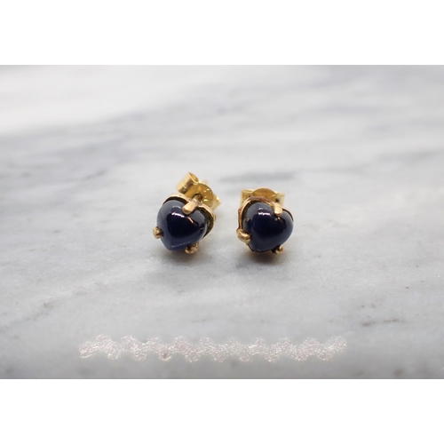 21 - A Pair of Sapphire Earrings each claw-set heart shaped cabochon in 18ct gold