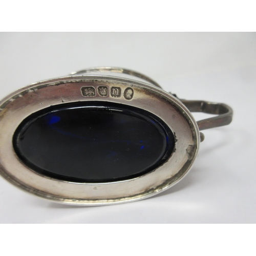 219 - A Victorian silver oval Mustard Pot, semi-fluted with hinged cover enclosing blue glass liner, Londo... 