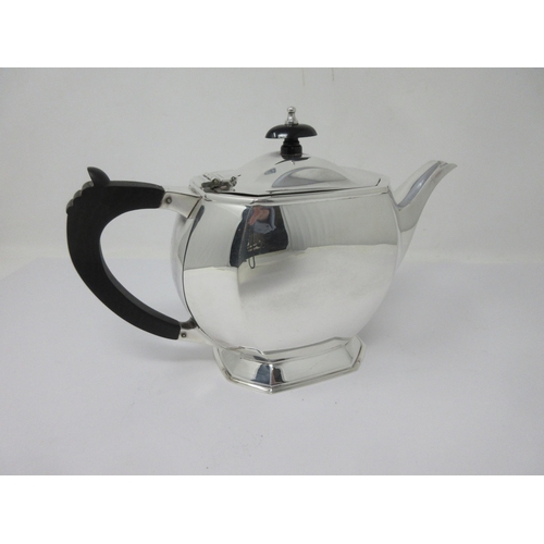 232 - A modern silver Teapot of panelled octagonal form with ebonised handle, Sheffield 1993, marked Aspre... 