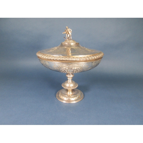 234 - A Victorian silver Pedestal Bowl and Cover, the lid with figure and anchor finial, four embossed ova... 