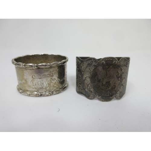 238 - Two silver Napkin Rings with engraved decoration and initials, Sheffield 1899 and London 1911, one c... 