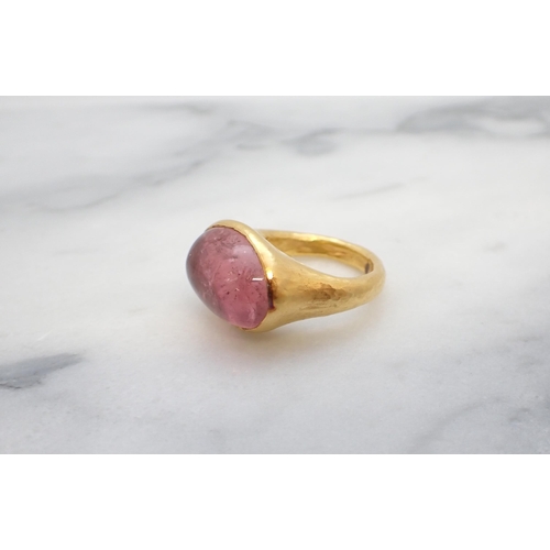 35 - A 22ct gold Ring rubover-set oval pink cabochon, ring size K 1/2, approx 10gms all in