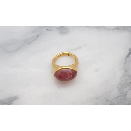 35 - A 22ct gold Ring rubover-set oval pink cabochon, ring size K 1/2, approx 10gms all in