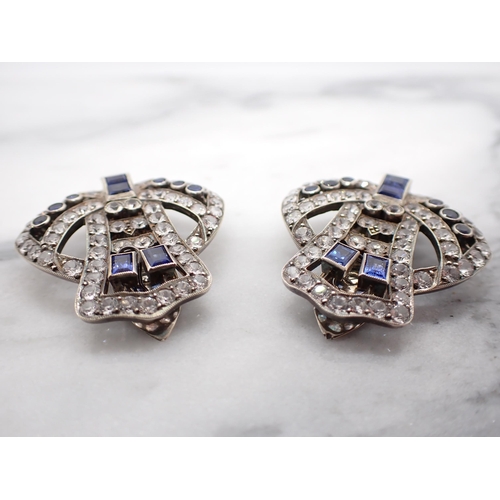 40 - A pair of Art Deco Clips millegrain-set baguette-cut sapphires and synthetic white brilliant-cut sto... 