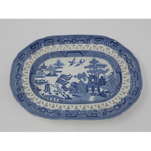 438 - A 19th Century blue and white Willow pattern Chestnut Basket and Stand with pierced lattice design, ... 