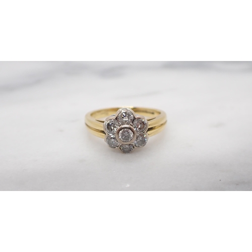 44 - A Diamond Daisy Cluster Ring rubover-set seven brilliant-cut stones in 18ct gold, ring size J, appro... 