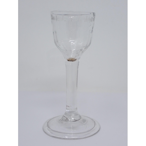 449 - A Georgian Wine Glass with facet cut bowl and engraved border, on a plain stem, 5½ in H, and a squat... 