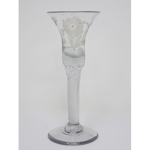 457 - A Jacobite Wine Glass with engraved thistle and rose decoration on spiral twist column and domed foo... 