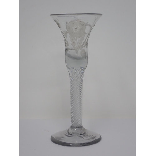 457 - A Jacobite Wine Glass with engraved thistle and rose decoration on spiral twist column and domed foo... 