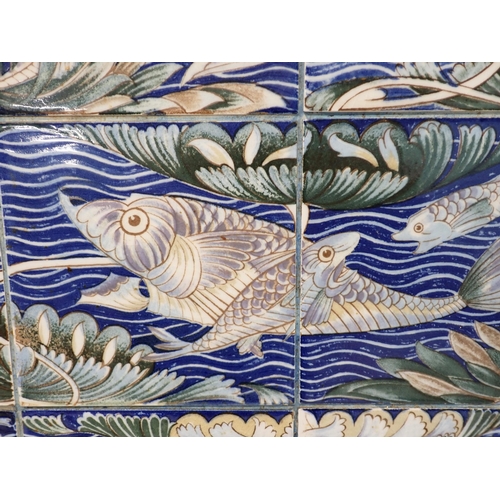 459 - A Panel of twelve tiles with Persian fish design by William de Morgan for William Morris, mounted on... 