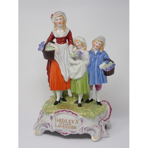 468 - A Yardley's Old English Lavender figural group of lady holding basket of lavender with two children ... 