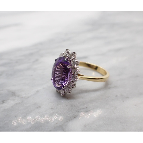 47 - An Amethyst and Diamond Cluster Ring claw-set oval-cut amethyst, 3cts, within a frame of brilliant-c... 