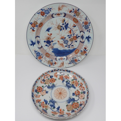 482 - An Imari circular Charger with figure of bird in a landscape, 14in, and another with stylised floral... 