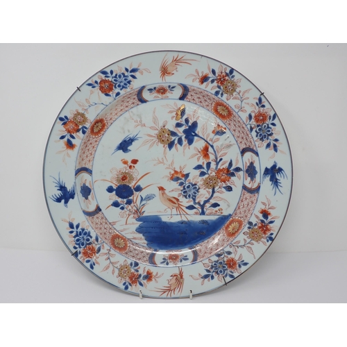 482 - An Imari circular Charger with figure of bird in a landscape, 14in, and another with stylised floral... 