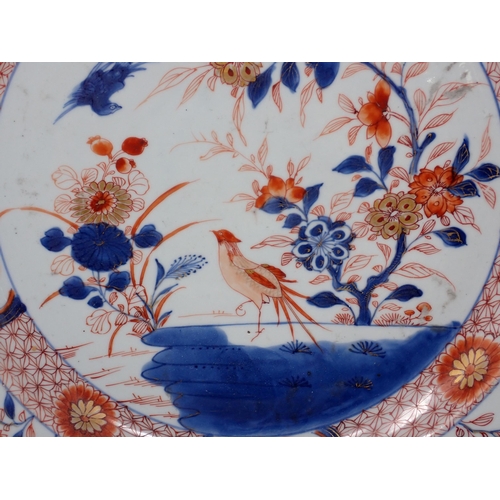 482 - An Imari circular Charger with figure of bird in a landscape, 14in, and another with stylised floral... 