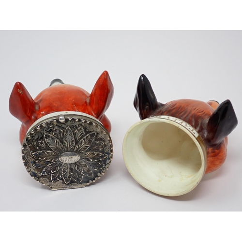 484 - Two fox mask Stirrup Cups, one titled 'Tally Ho' and another with white metal lid having embossed fl... 