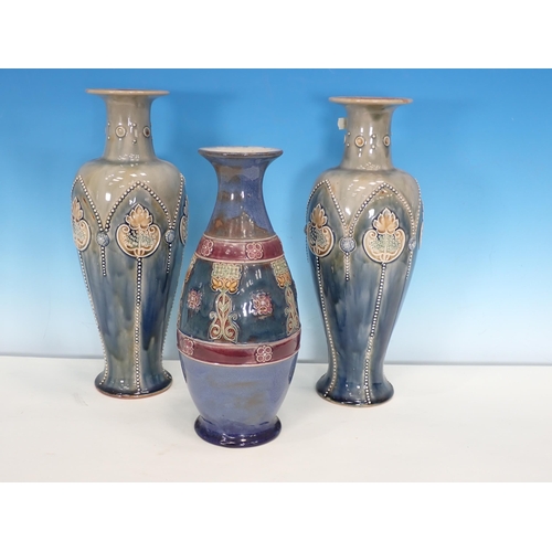 485 - A pair of Royal Doulton slender Vases with stylised flowers and raised beadwork, 13in H, and a Doult... 