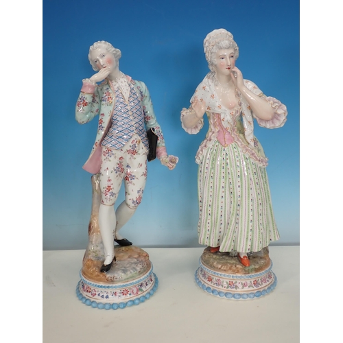 487 - A pair of Continental Figures in period costumes on circular floral bases, 14in H, and three Contine... 