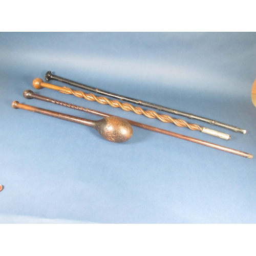 506 - A Knobkerrie, 18in, and three hardwood Sticks, one with double spiral snake design