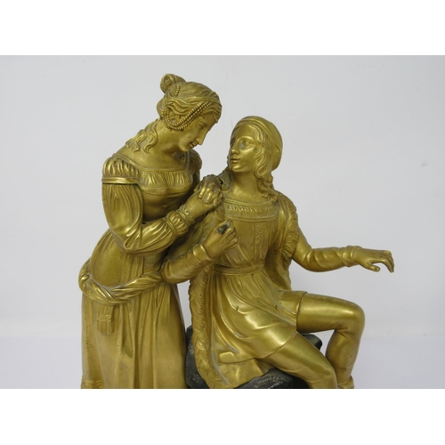 511 - A 19th Century gilt-bronze romantic couple on a naturalistic base, 10½in