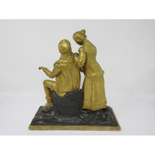 511 - A 19th Century gilt-bronze romantic couple on a naturalistic base, 10½in