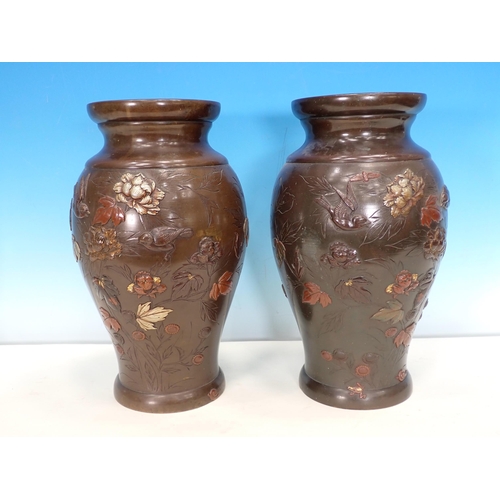 516 - A pair of baluster bronze Vases decorated moulded, floral, leaf, bird and insect design in various c... 