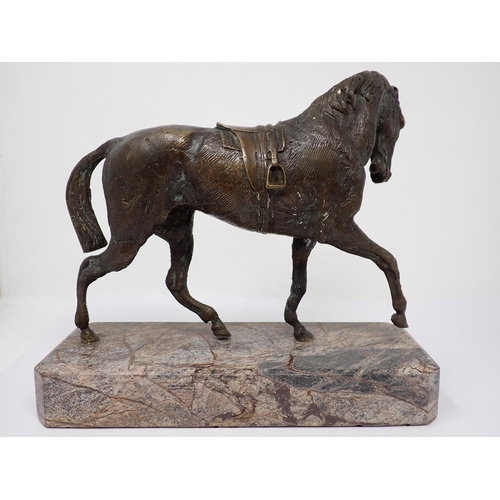 517 - A bronze figure of a Horse with saddle on marble base, 9in L