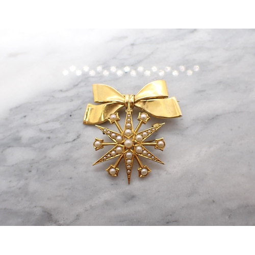 54 - A Victorian Seed Pearl Star Brooch stamped 15ct suspended from later 9ct gold bow brooch. Diameter o... 