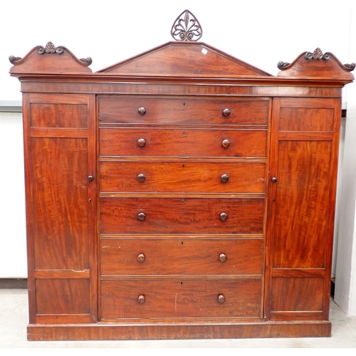 598 - A 19th Century mahogany Gentleman's Secretaire Cabinet having arched pediment, with a hinged pair of... 