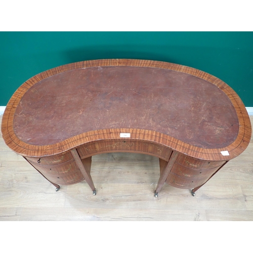 279 - An Edwardian satinwood kidney-shaped ladies Writing Desk with leather inset top fitted on arrangemen... 