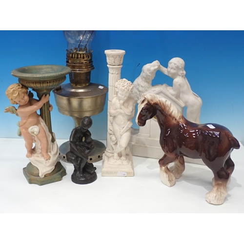 641 - A paraffin Lamp, a plaster Mantel Clock, Plaster Figures of Cherubs, pottery Cart horse etc