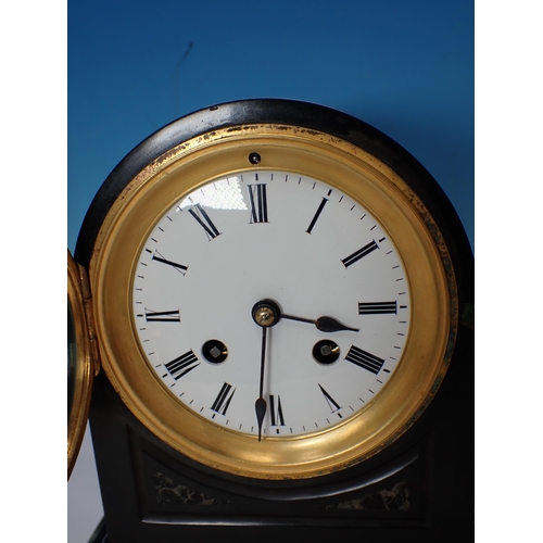 653 - A black and variegated marble Mantel Clock with circular dial, 9in H