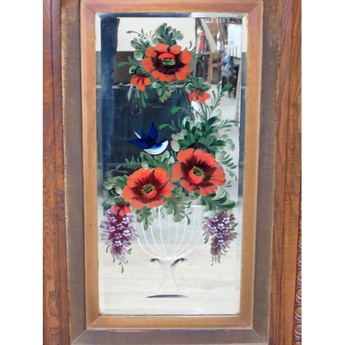 721 - A pair of floral painted Wall Mirrors, 2ft 8in x 1ft 9in