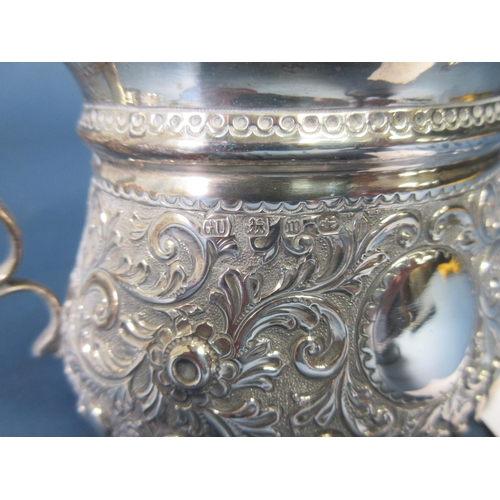 118 - A Victorian silver two-handled Sugar Bowl with floral scroll embossing and vacant cartouches, Birmin... 