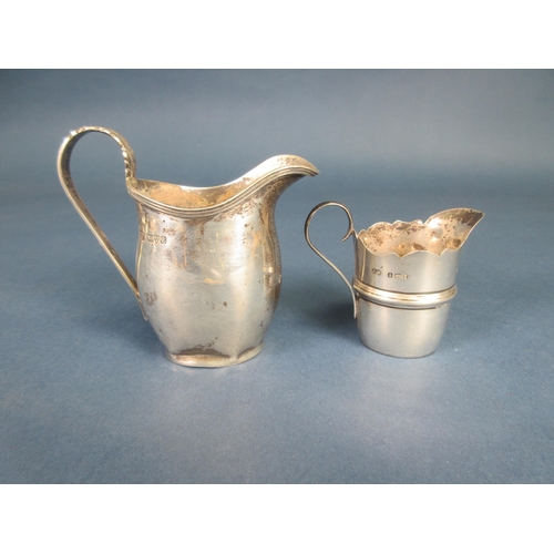 120 - A George V silver oval Cream Jug, Chester 1930, and a smaller Jug, Birmingham 1906