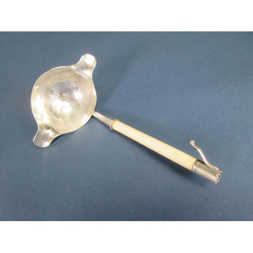 122 - An Elizabeth II silver double lipped Ladle with hammered design and turned bone handle, Birmingham 1... 