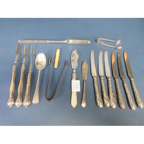 135 - Two pairs of silver Sugar Tongs, three silver Forks, two Butter Knives, plated Marrow Scoop, etc