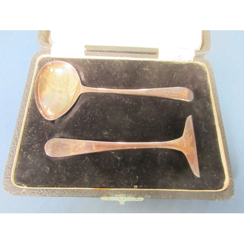 148 - A George V silver two handled Trophy, Birmingham 1911, 330gms and a silver Pusher and Spoon, Sheffie... 