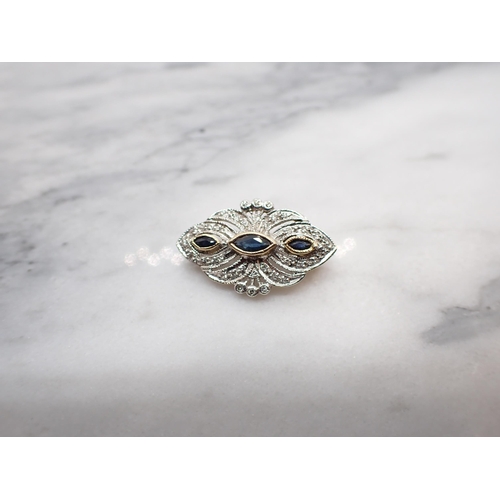 160 - A Sapphire and Diamond Brooch millegrain-set three marquise-cut sapphires within pierced frame of ei... 