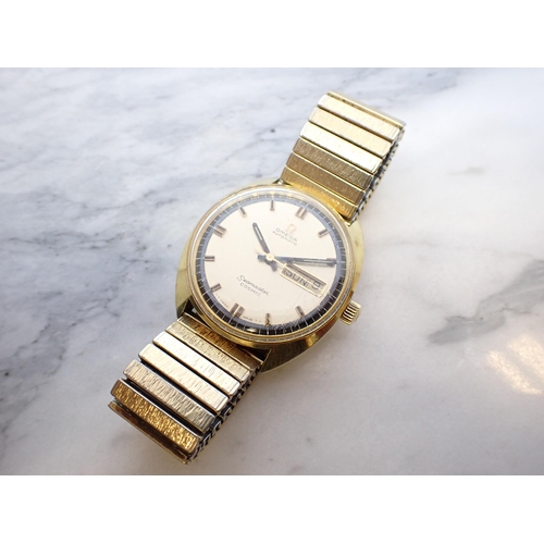 169 - A gentleman's Omega Automatic Seamaster Cosmic Wristwatch the champagne dial with hourly baton marke... 