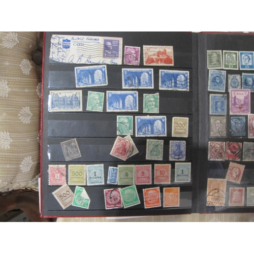 256 - An All World Stamp selection, contained in various albums