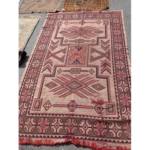 275 - A North African beige ground Rug with geometric design 7ft 8in L x 5ft W, two antique Persian Rugs, ... 