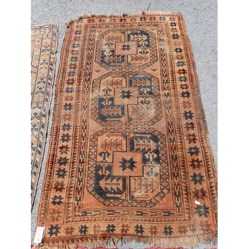 275 - A North African beige ground Rug with geometric design 7ft 8in L x 5ft W, two antique Persian Rugs, ... 