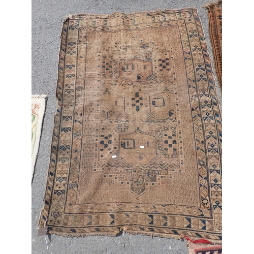 275 - A North African beige ground Rug with geometric design 7ft 8in L x 5ft W, two antique Persian Rugs, ... 