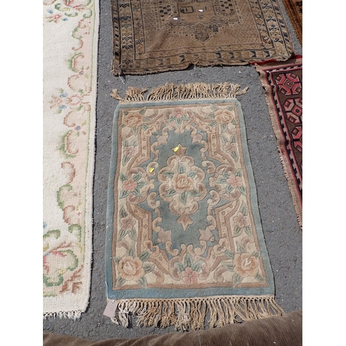 275 - A North African beige ground Rug with geometric design 7ft 8in L x 5ft W, two antique Persian Rugs, ... 