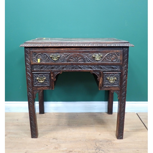 306 - A 19th Century oak Lowboy fitted three drawers with carved design on square cut supports 2ft 6in W x... 